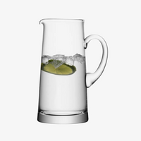 The LSA Bar Tapered Pitcher is shown filled with water, ice cubes, and a slice of lime, set against a plain white background.