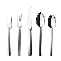 The Georg Jensen Bernadotte Flatware 5 Piece Setting, featuring matching vertically striped handles, is arranged upright on a white background.