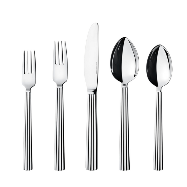 The Georg Jensen Bernadotte Flatware 5 Piece Setting, featuring matching vertically striped handles, is arranged upright on a white background.