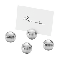 The Georg Jensen Bernadotte Table Card Holders Set of 4 features round, silver, ribbed Art Deco designs—ideal for elegantly displaying names like "Marie" at your table.