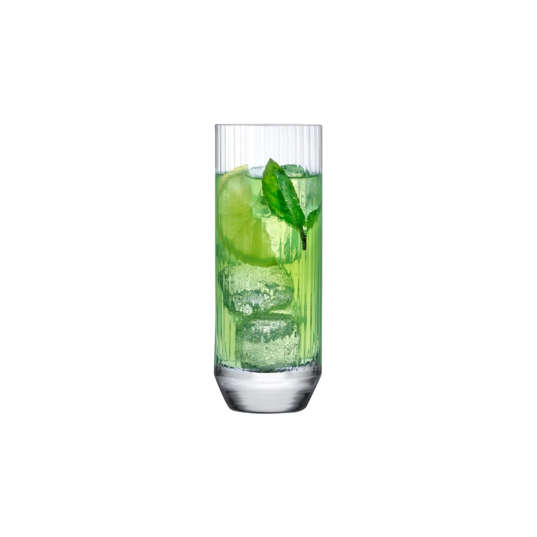 A tall green drink with ice, lime, and mint sits in a modern glass from the Big Top Barware Set of 4 by Nude Glassware, beautifully showcased against a plain white background.