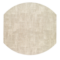 The New Luster Elliptic Placemat Set of 4 by Bodrum is shown in light beige with a textured, octagon-shaped design and slightly rounded edges, featuring elegant fabric and a subtle woven look against a white background.