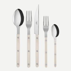 The Sabre Bistrot Pearly 5 Piece Setting - Shiny includes a tablespoon, dinner knife, dinner fork, salad fork, and teaspoon—each with cream mother-of-pearl handles and metal rivets—shown upright on a white background.