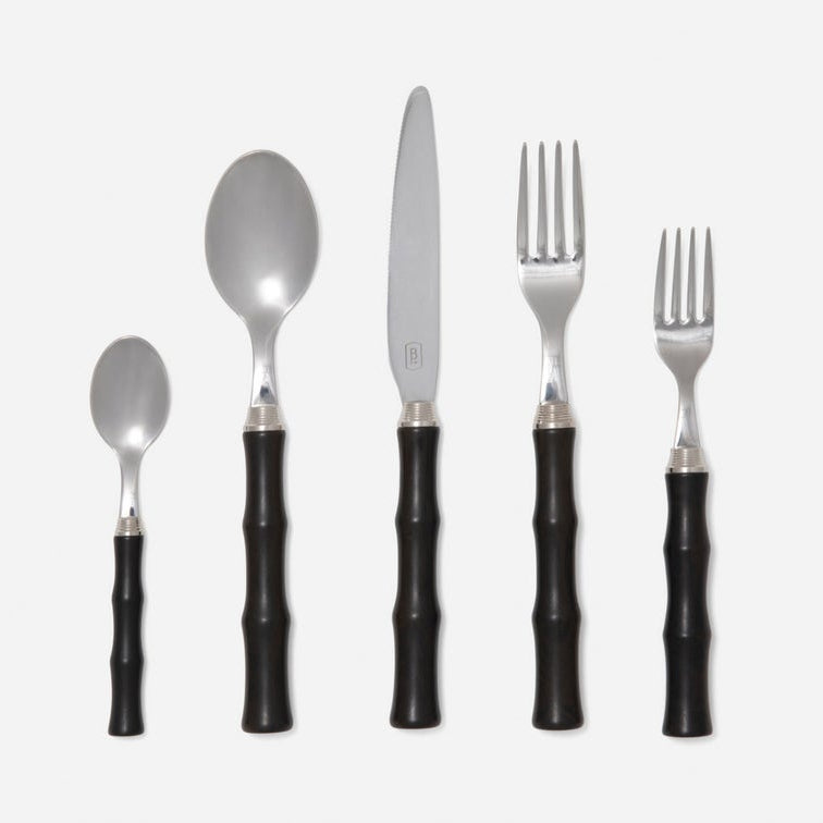 The Blue Pheasant Montecito Flatware 5 Piece Setting in Dark Brown features stainless steel teaspoon, soup spoon, knife, dinner fork, and salad fork with bamboo-style handles. All pieces are dishwasher safe and arranged on a white background.
