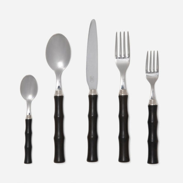 The Blue Pheasant Montecito Flatware 5 Piece Setting in Dark Brown features stainless steel teaspoon, soup spoon, knife, dinner fork, and salad fork with bamboo-style handles. All pieces are dishwasher safe and arranged on a white background.