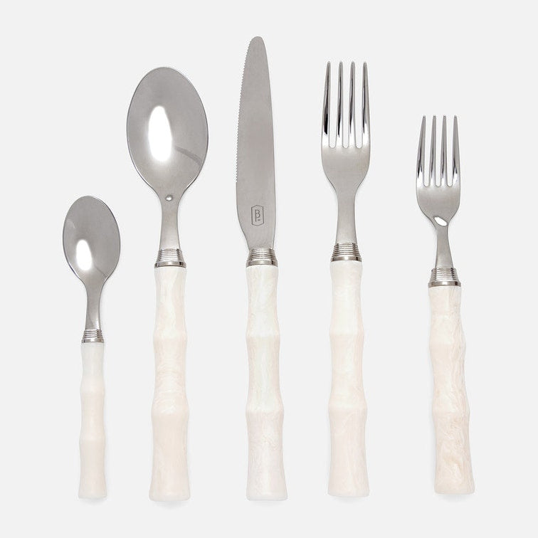 The Blue Pheasant Montecito Flatware 5 Piece Setting in Ivory features stainless steel heads and textured, bamboo-style ivory handles. Includes knife, large fork, small fork, large spoon, and small spoon, all shown upright on a light background.