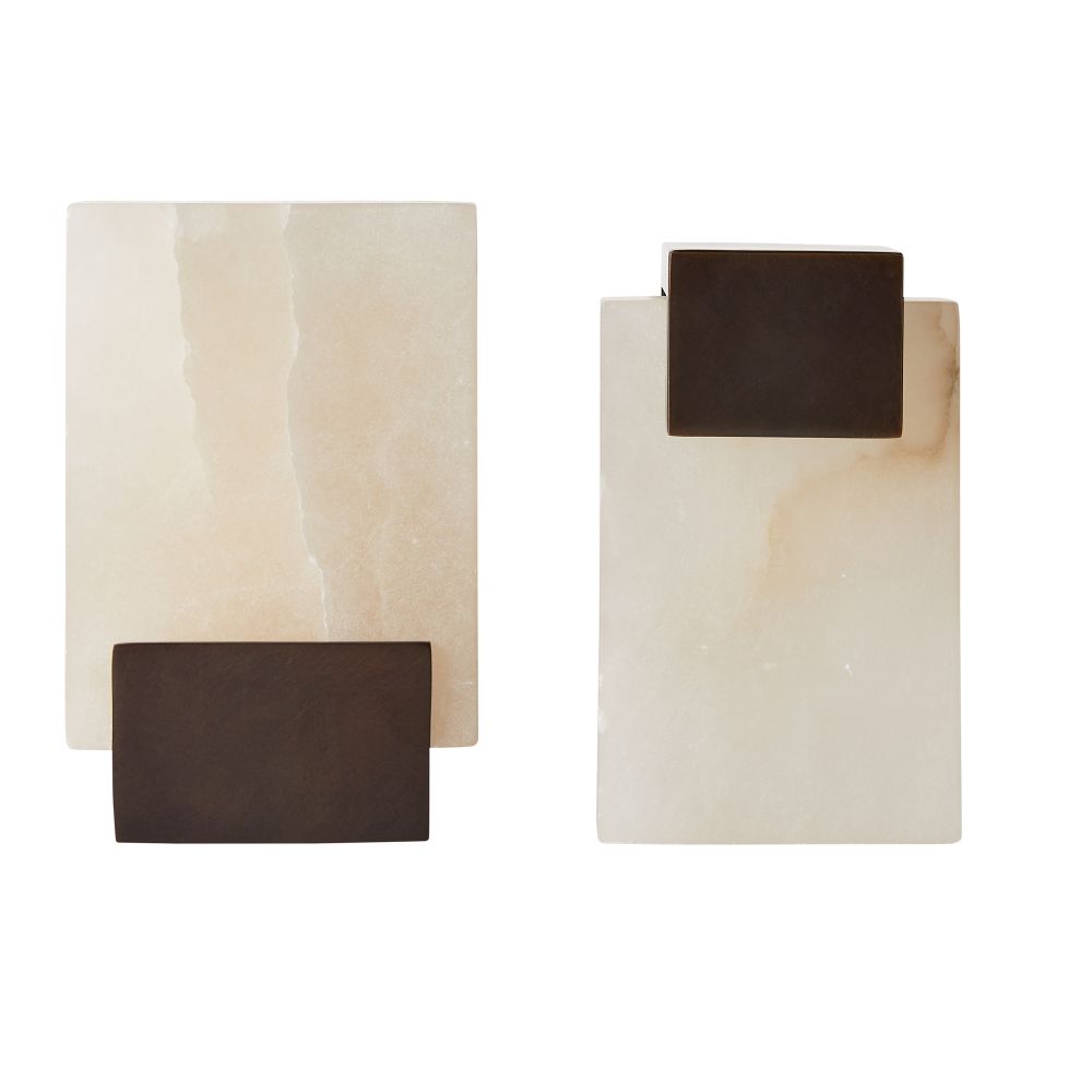 The Tolliver Bookends Set of 2 by Arteriors features rectangular off-white stone forms with dark brown accents, echoing the elegance of alabaster bookends and resembling decorative sculptures.