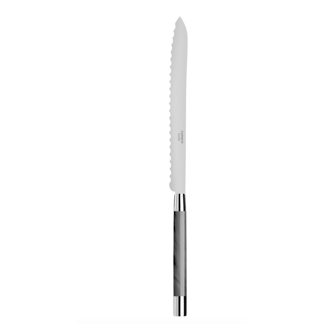 The Capdeco Conty Bread Knife Grey, made in France, features a serrated silver blade and a shiny marble-patterned handle, displayed on a white background.