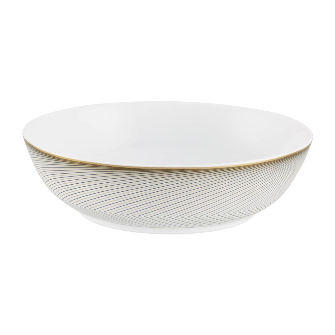 The Oskar Dinnerware by Raynaud is a white ceramic bowl featuring a smooth, modern look with a subtle gold rim and thin diagonal lines forming an elegant geometric design around the outside.