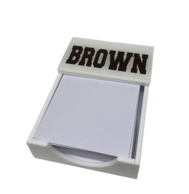 The Eye Candy College Note Pad features a white holder with "BROWN" in bold, dark letters across a clear top.