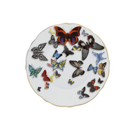 This Vista Alegre Butterfly Parade Dinnerware piece is a white porcelain plate with a gold rim, decorated with vibrant butterfly designs in assorted sizes—ideal for mixing and matching your dinnerware settings.