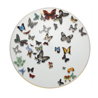 A round white plate with a gold rim from the Vista Alegre Butterfly Parade Dinnerware collection, decorated with colorful butterflies—ideal for mix-and-match settings and bringing a luxurious touch to your table.