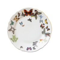 A white porcelain plate from Vista Alegre’s Butterfly Parade Dinnerware, featuring colorful butterflies and moths around the rim—perfect for luxury table settings or mixing and matching dinnerware styles.