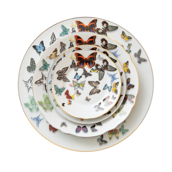 Four white porcelain plates from the Vista Alegre Butterfly Parade Dinnerware collection, each with colorful butterfly designs and gold rims, are stacked together—ideal for luxury dinnerware enthusiasts to mix and match.