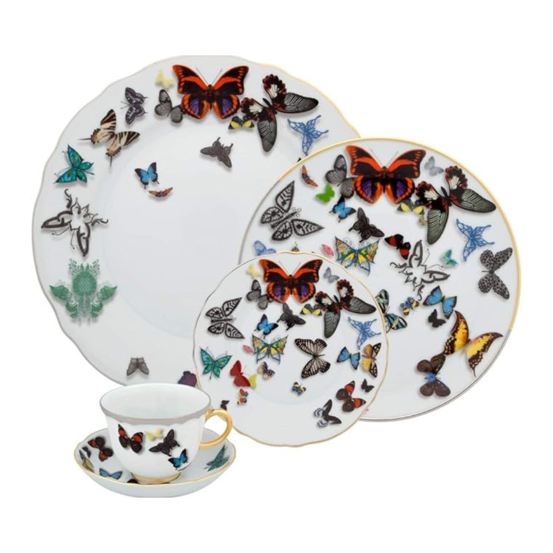 Butterfly Parade Dinnerware by Vista Alegre: white porcelain plates, teacup, and saucer adorned with colorful butterflies and gold accents—a striking addition to your luxury dinnerware collection.
