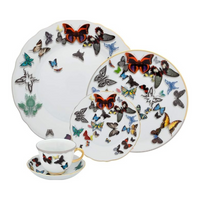 Butterfly Parade Dinnerware by Vista Alegre: white porcelain plates, teacup, and saucer adorned with colorful butterflies and gold accents—a striking addition to your luxury dinnerware collection.