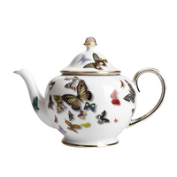A white porcelain teapot with a gold-trimmed lid and handle, featuring colorful butterflies from the Vista Alegre Butterfly Parade Dinnerware—perfect for mixing and matching with other luxury tableware or this collection.