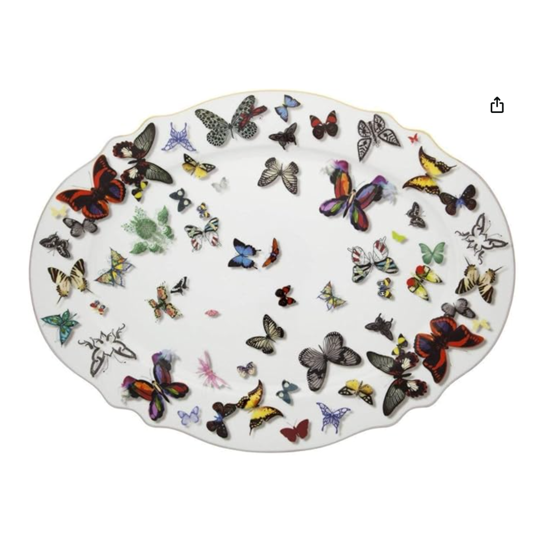 An oval white porcelain platter from Vista Alegre’s Butterfly Parade Dinnerware collection, featuring colorful butterflies in assorted sizes—ideal for mix-and-match table settings.