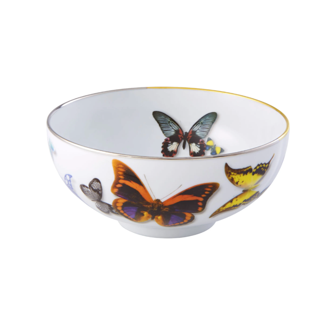 A white porcelain bowl from Vista Alegre's Butterfly Parade Dinnerware, featuring colorful butterflies and a gold rim—ideal for mixing and matching in any luxury dinnerware collection.