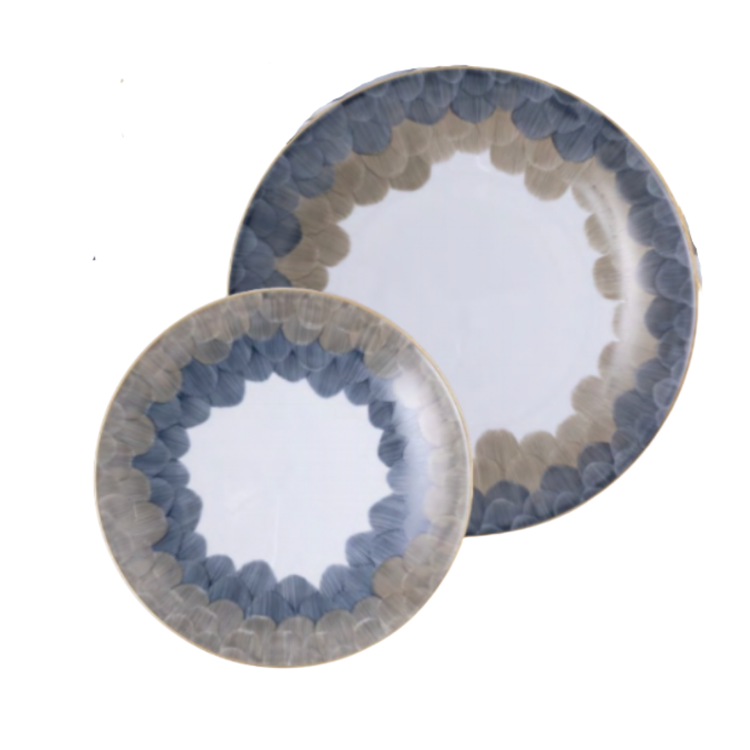 Two Marie Daâge Cercle D’Ecailles Platinum Filet porcelain plates with a decorative border of overlapping blue and grey scale-like patterns and thin metallic rims.