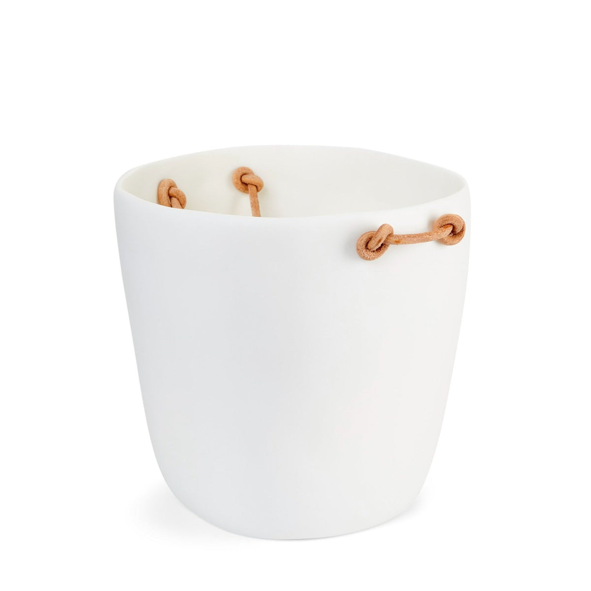 The Tina Frey Champagne Bucket Leather Handle is a white, round ceramic planter with an irregular rim and three tan leather handles looped decoratively through holes near the top.
