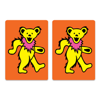 Two identical yellow dancing bears with pink collars, inspired by Grateful Dead artwork, appear mid-step on orange backgrounds—ideal for high-quality Canasta Card Sets from Canasta Sets.