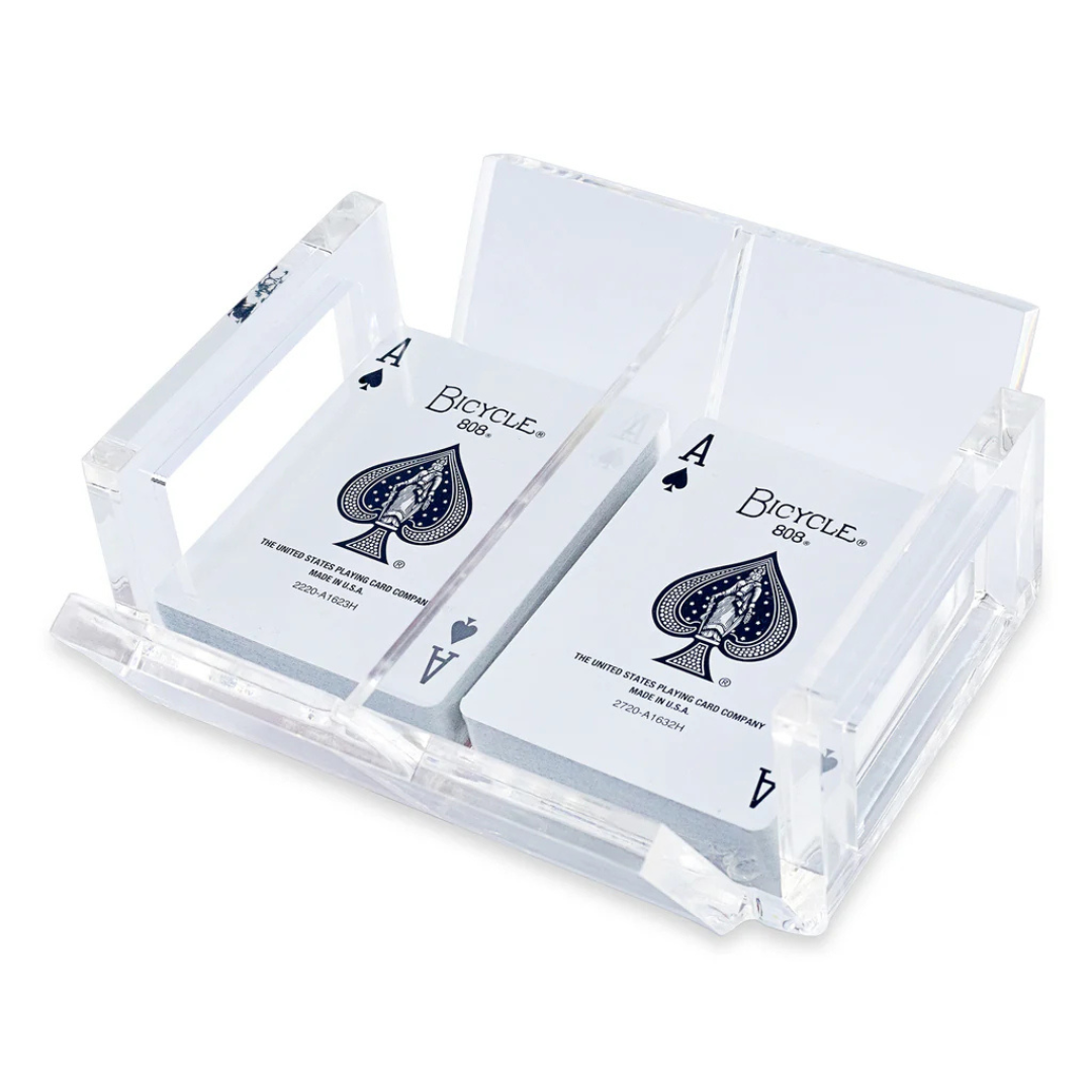 The Luxe Dominoes El Canasta Tray holds two decks of playing cards, each showing the ace of spades, in a clear acrylic display—perfect for game night.