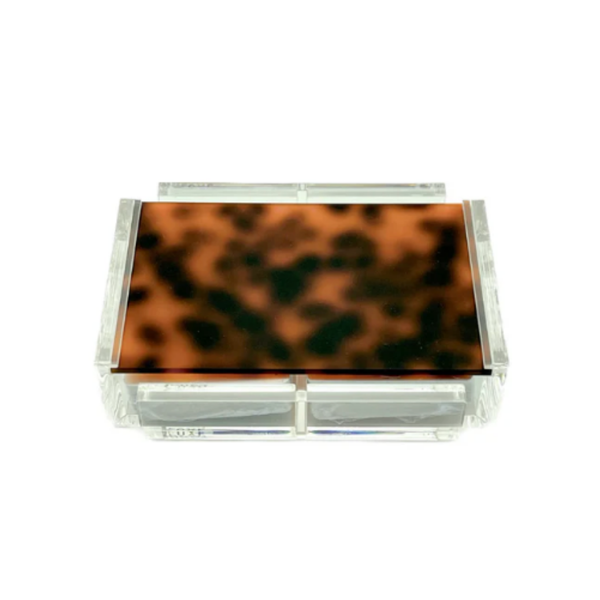 Store your La Pinta Card Deck - Tortoise by Luxe Dominoes in a clear acrylic box with two drawers and a rectangular lid with a brown and black tortoiseshell pattern—ideal for displaying or protecting your luxury cards.