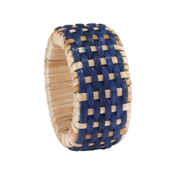 The Bodrum Cane Napkin Ring Set of 4 features chunky, textured woven rings in natural and blue fibers with a checkered pattern—ideal for adding rustic charm to your table setting.