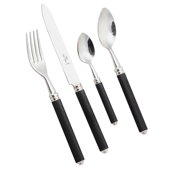 The Alain Saint-Joanis Cedre Black 5 Piece Setting features silver-plated flatware with textured black handles, including a fork, knife, tablespoon, teaspoon, and dessert spoon—displayed side by side on a white background.