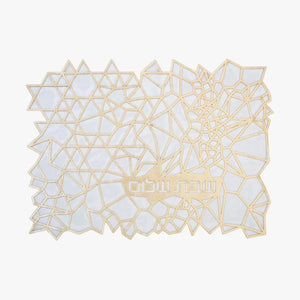 The Apeloig Geometric Challah Cover features intricate gold and white abstract polygonal shapes with Hebrew text near the bottom center, offering a modern and elegant design.