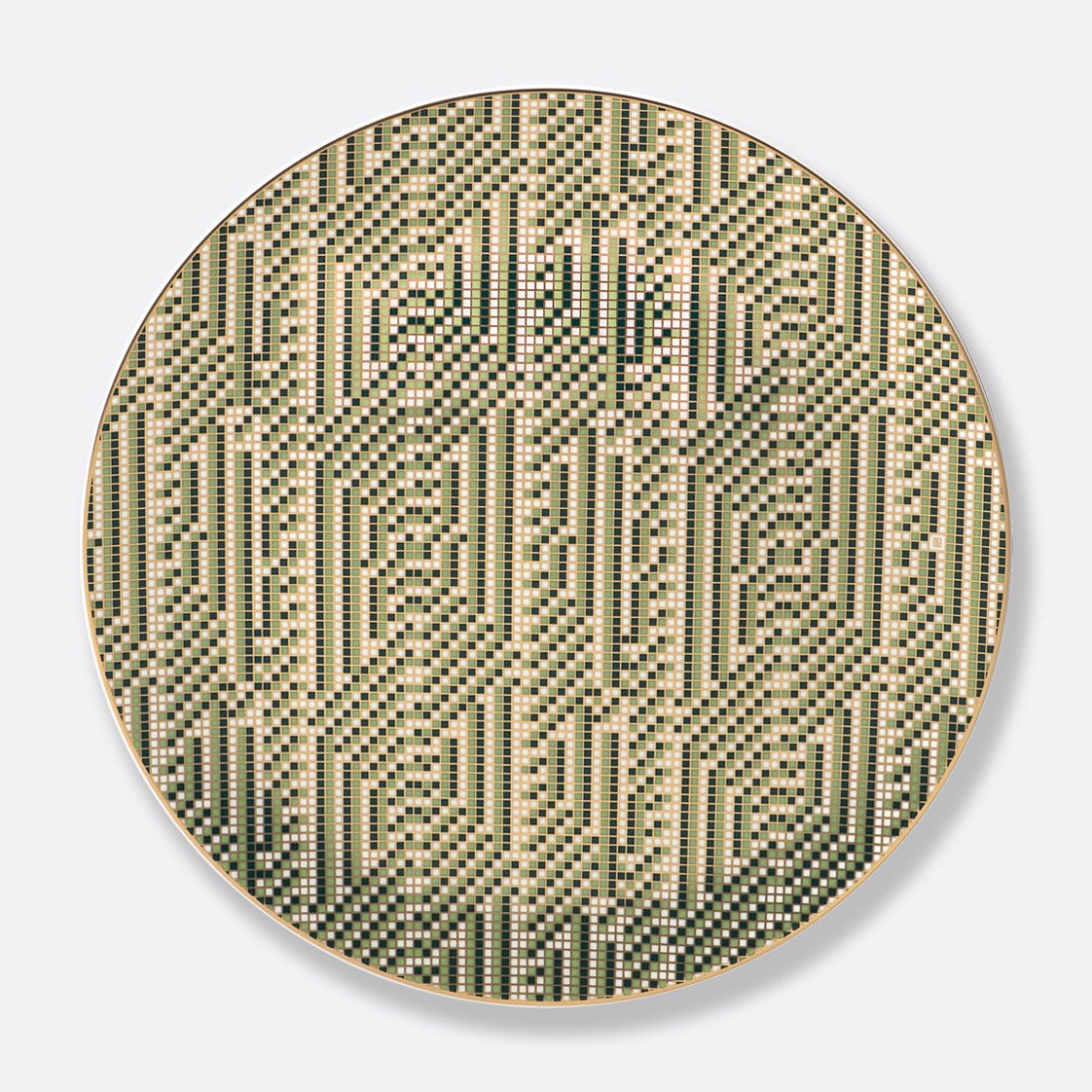 The Augusta Dinnerware by Bernardaud features an Art Deco-inspired round porcelain design with geometric patterns of green, beige, and black square dots in zigzag columns on a smooth light gray background.