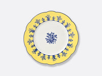 The Chateaubriand Dinnerware dessert plate by Bernardaud features a yellow scalloped edge, blue floral designs, and a matching center pattern, all set on a light gray background.