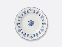 The Bernardaud Chateaubriand Dinnerware dessert plate features a blue floral rim and a blue rose bouquet in the center, making it perfect for serving sweet treats.