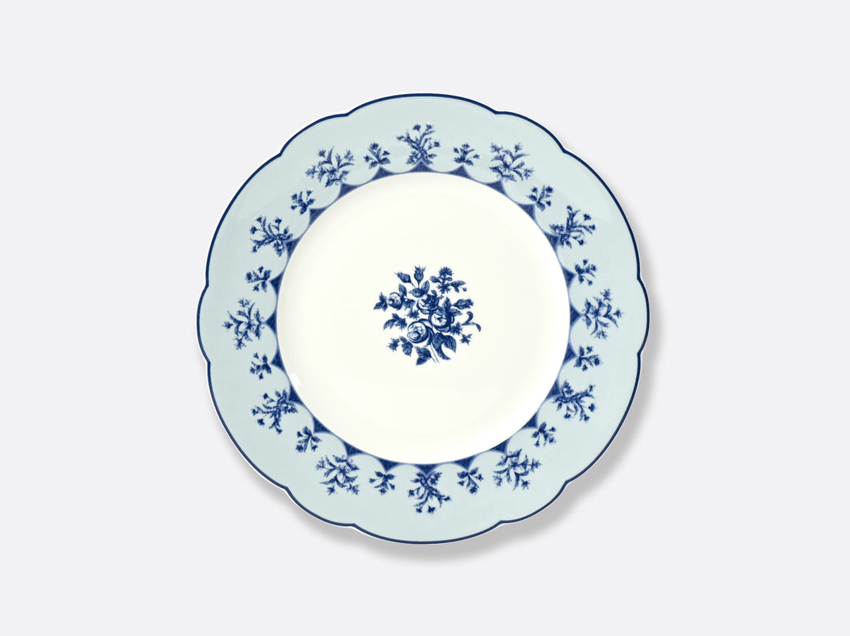 The Bernardaud Chateaubriand Dinnerware dessert plate features a scalloped edge with a blue floral rim and central bouquet, all on crisp white porcelain.