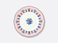 The Bernardaud Chateaubriand Dinnerware features a round ceramic dessert plate with scalloped edges, a pale pink border accented by blue florals, and a matching central motif—ideal for serving Chateaubriand.