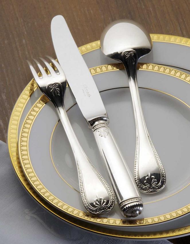 The Christofle Malmaison 5 Piece Setting in silver plate, featuring elegant cutlery, is beautifully displayed on a gold-rimmed plate—ideal for formal dining.
