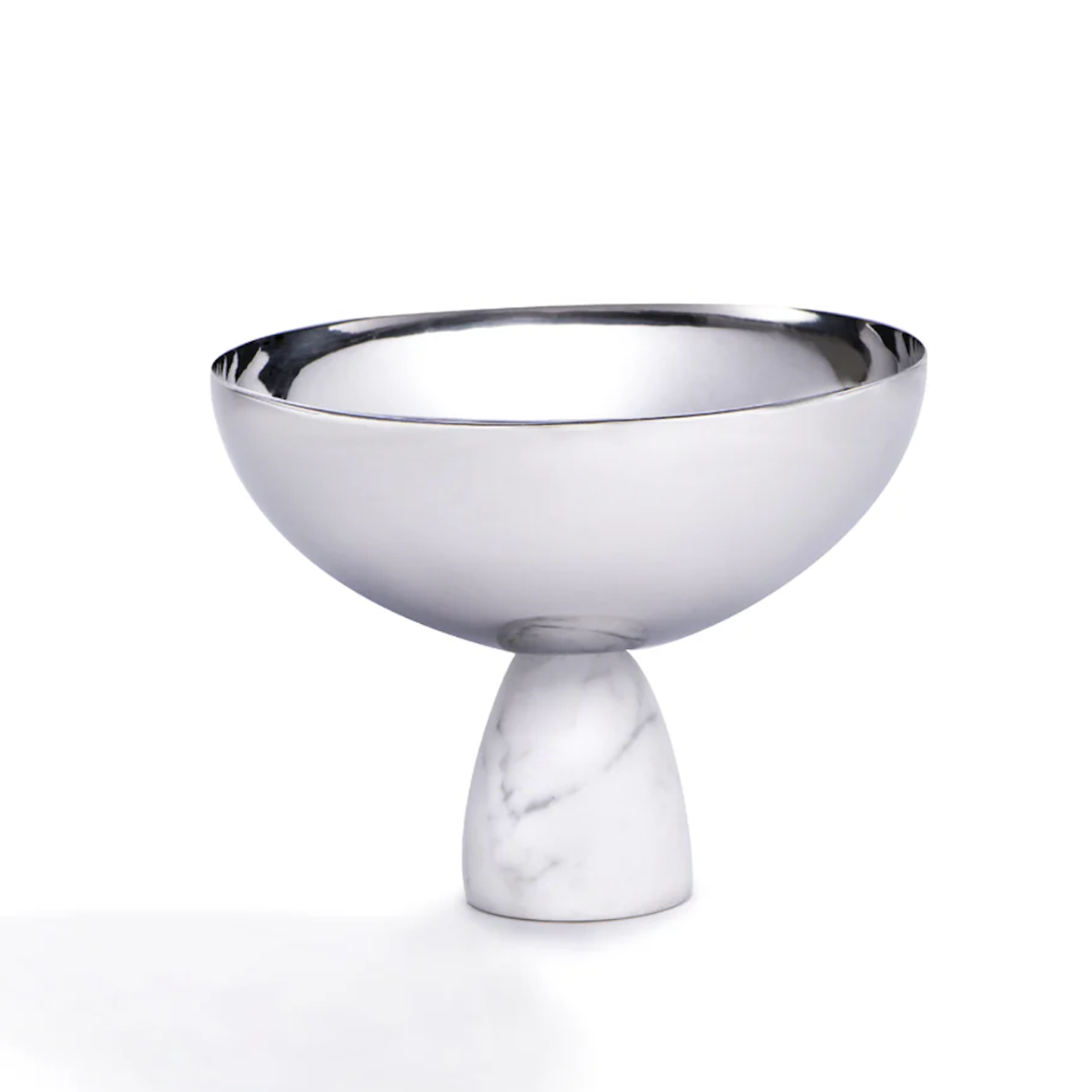 The Coluna Carrara Marble Nut Bowl by Anna New York features a reflective metal top and an Italian Carrara marble base, displayed against a plain white background.