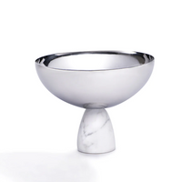 The Coluna Carrara Marble Nut Bowl by Anna New York features a reflective metal top and an Italian Carrara marble base, displayed against a plain white background.