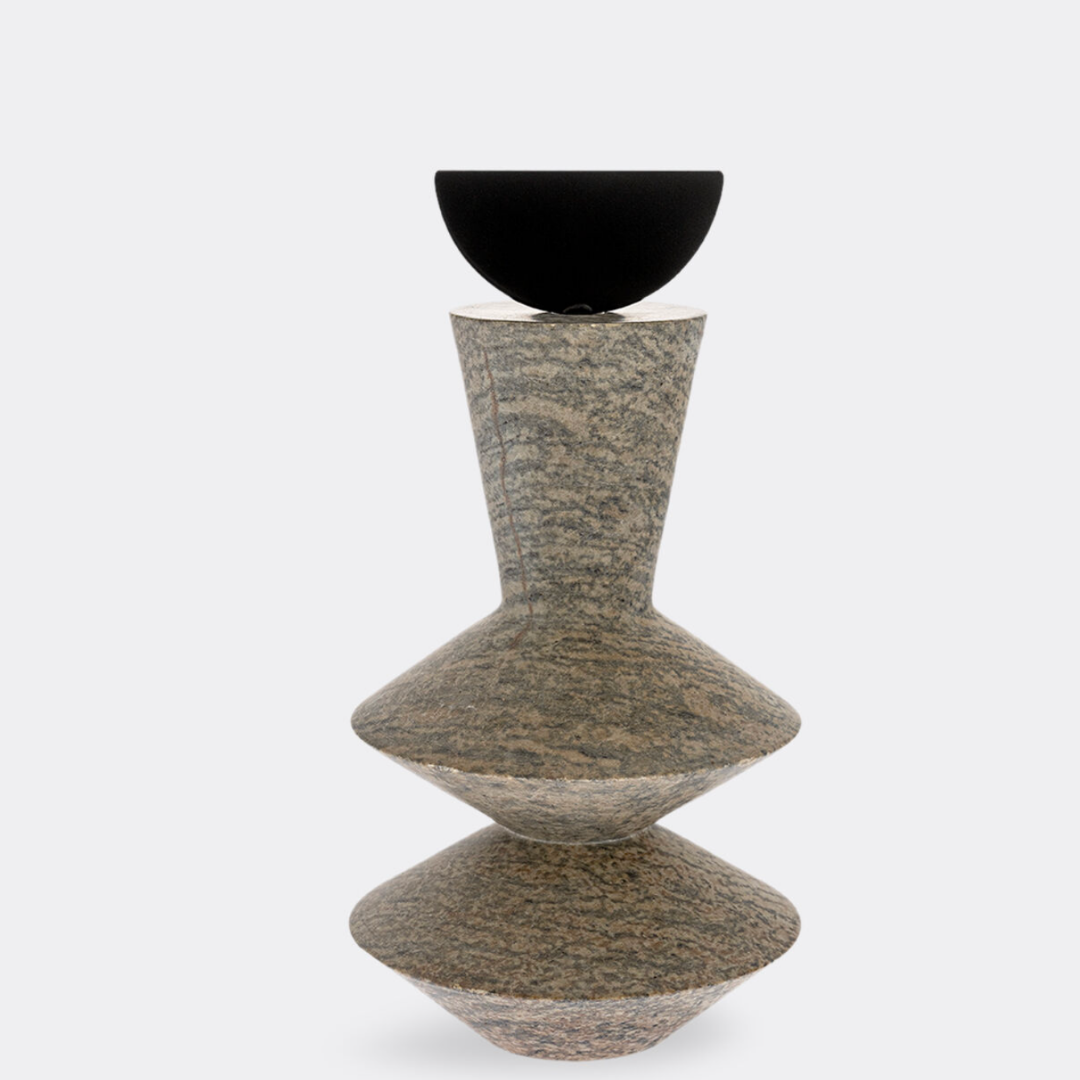 The Gardeco Constantin Gray w/ Black Sculpture features two stacked, geometric stone shapes with a textured gray-brown finish, topped by a smooth black half-sphere. Its modernist design makes it ideal for contemporary home decor. Displayed against a plain white background.