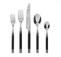 The Capdeco Conty Flatware 5 Piece Setting in Black Wood—salad fork, dinner fork, knife, soup spoon, and teaspoon—features black handles and silver tops arranged in a row on a white background.