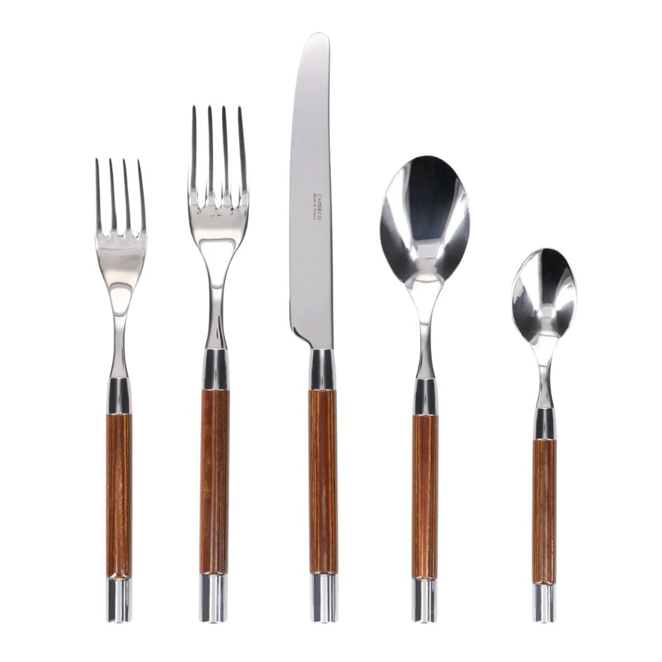 The Capdeco Conty Flatware 5 Piece Setting in Brown Wood features 18/10 stainless steel heads and wooden handles—salad fork, dinner fork, dinner knife, soup spoon, and teaspoon—shown upright in a row on a white background.