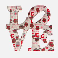 The Eye Candy College Love Sculpture displays "LOVE" in bold capitals, each letter adorned with Cornell University logos and the Bear mascot—creating a unique logo piece, perfect as a graduation gift on a white background.