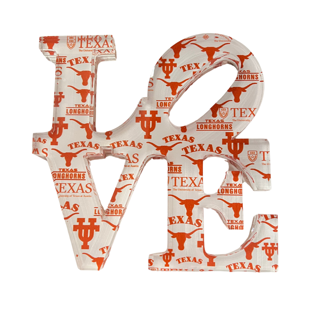 The Eye Candy College Love Sculpture features Texas Longhorns logos and burnt orange longhorn silhouettes on a crisp white background—perfect as a college-themed decor piece or unique graduation gift.