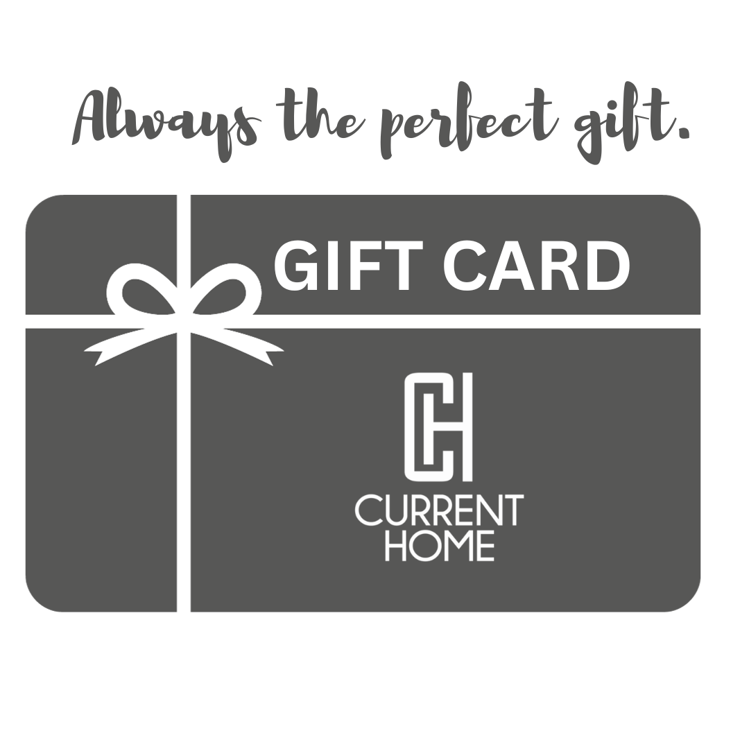 A gray Current Home NY Gift Card featuring a white ribbon and monogram logo, labeled "GIFT CARD" and "CURRENT HOME." Above the card: "Always the perfect gift." Available as an E-gift card for any occasion.