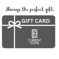 A gray Current Home NY Gift Card featuring a white ribbon and monogram logo, labeled "GIFT CARD" and "CURRENT HOME." Above the card: "Always the perfect gift." Available as an E-gift card for any occasion.