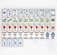 A Brilliant Nights Hanukkah in Gift Box Mahjong Tile Set featuring acrylic tiles decorated with Stars of David, dreidels, menorahs, and Hebrew characters.