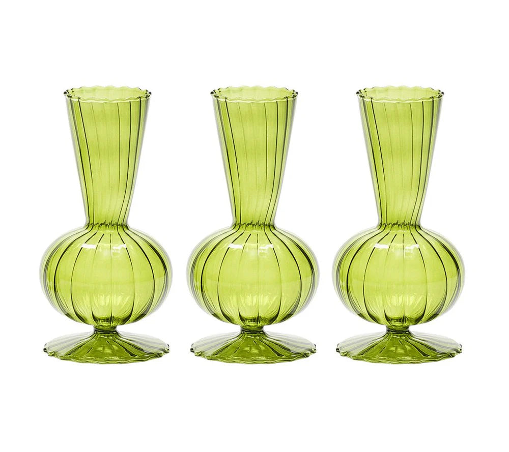 The Kim Seybert Tess Bud Vase Set of 3 in Olive features identical green glass vases with bulbous bases, narrow necks, flared openings, and elegant vertical stripes, arranged in a row against a white background.