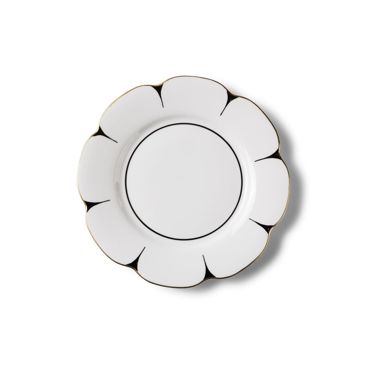 The Drops Dinnerware plate by Molecot features a flower-inspired shape in Limoges porcelain, with scalloped edges, thin black lines outlining each segment, and a gold-finished rim for an elegant look on a white background.