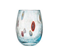 The Gala Stemless Tumbler Set 4 by Kim Seybert features clear, textured glasses with a subtle blue tint and vibrant oval-shaped spots in red, orange, and blue tones artfully arranged around each tumbler. Inspired by classic Murano Glass techniques, these colorful pieces offer a lively yet elegant look.